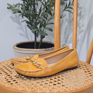 Stuart Weitzman Mustard Patent Leather Loafers with Gold Chain